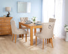Rectangular Oak Dining Table and 4 Cream Linen Verona Dining Chairs with Chrome Knocker and Oak Legs