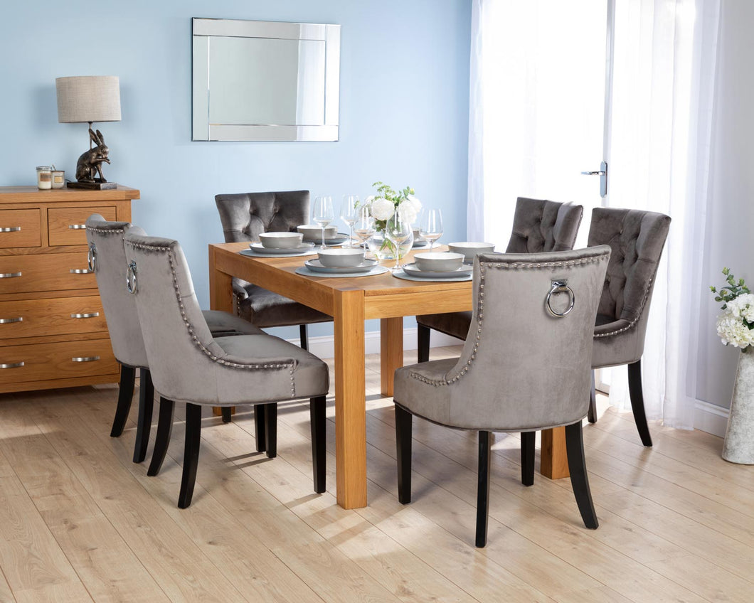 Rectangular Oak Dining Table and 6 Grey Velvet Verona Dining Chairs with Chrome Knocker and Black Legs